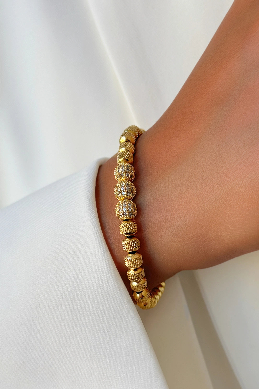 Versatile stainless steel Sail Relaxed bracelet styled on wrist – fine jewelry for everyday wear
